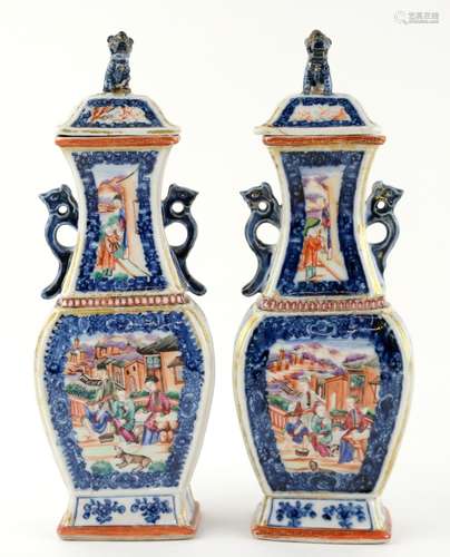 A pair of Chinese Export vases; each one with a domed cover and mythological animal finial; both