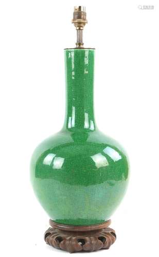 A green monochrome [p'ing kuo ch'ing or other] vase with oviform body and cylindrical neck,