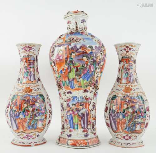 An elegant, associated garniture of three Chinese Export, famille rose vases; each one decorated