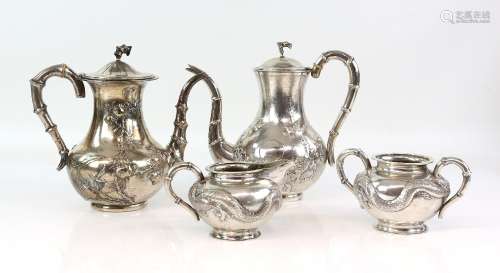 Chinese Export silver composite tea service, comprising a matches set of two teapots, both by
