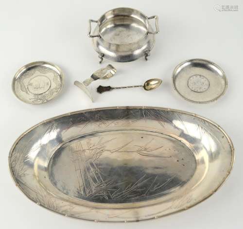 Six pieces of Chinese white metal, comprising: an oval tray, 31 cm diameter, decorated with