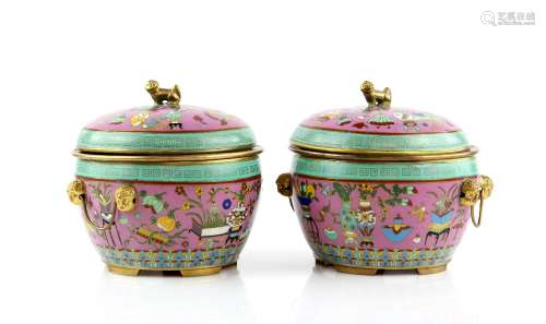 A pair of Chinese cloisonne enamel vessels; each one with domed cover and liner, decorated on the
