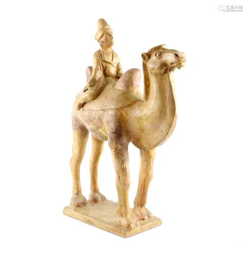 An impressive glazed pottery sculpture of a bearded, Western Asiatic, camel rider on the back of a