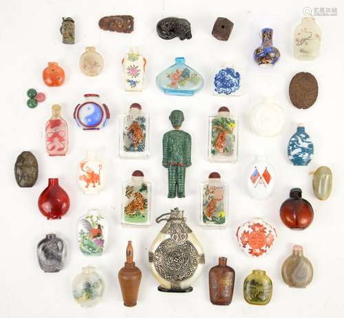 Thirty various Chinese snuff bottles [or other, similar small vessels], variously decorated with