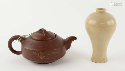 A Yixing stoneware teapot and domed cover, incised on the shoulder with prunus blossom and with a