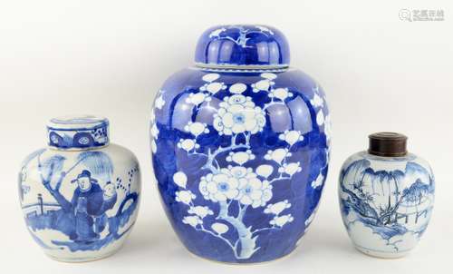 A blue and white oviform vase and domed cover, decorated with prunus, 26 cm high; together two other