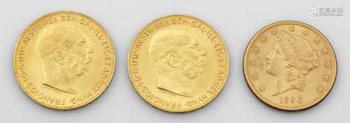 Drei Gold-Münzen von 1915 und 1896Dukatengold. Eine 20 Dollar Münze der Vereinigten Staaten von