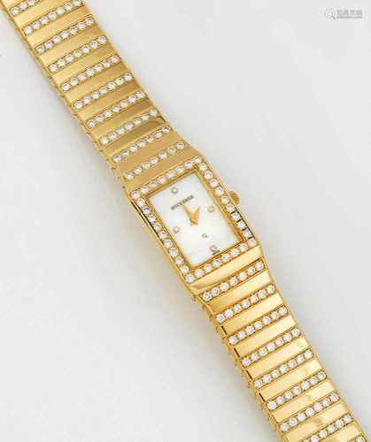 Repräsentative Schmuck-Damenarmbanduhr von BuchererGelbgold, gest. 750. Tankförmiges Uhrengehäuse in