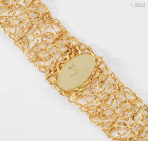 Extravagante Damenarmbanduhr von Chopard aus den 70er JahrenGelbgold, gest. 750. Breite Bandform aus