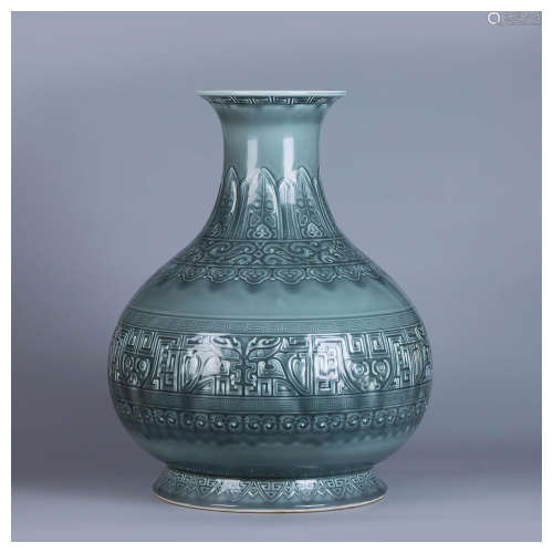 A Chinese Carved Celadon Glazed Porcelain Vase