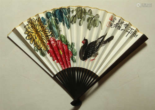 A CHINESE SCROLL PAINTING FAN OF FLOWER AND BIRD WITH CALLIGRAPHY BY QI BAISHI