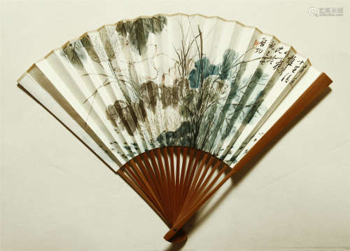 A CHINESE SCROLL PAINTING FAN OF FLOWER WITH CALLIGRAPHY BY QI GONG