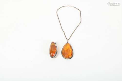 A Chinese Carved Amber Pendant and Necklace