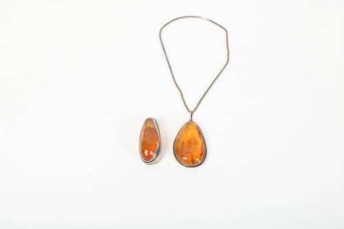 A Chinese Carved Amber Pendant and Necklace