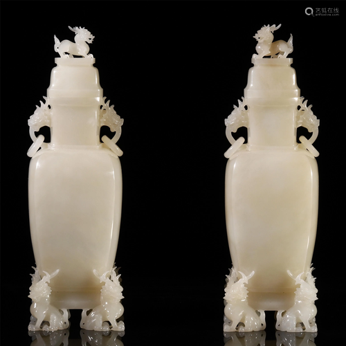 A PAIR OF CHINESE HETIAN WHITE JADE CAR…