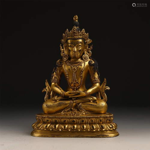 A FINELY CARVED GILT FIGURE OF BUDDHA …