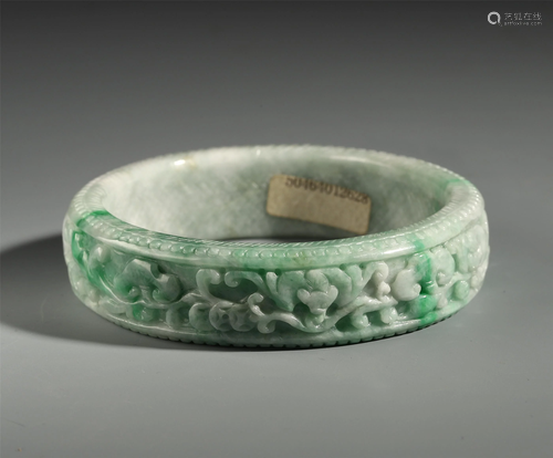 AN ANCIENT CHINESE GREEN JADEITE …