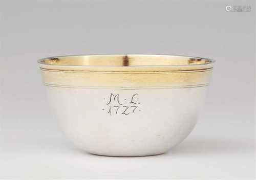 A Baroque parcel-gilt silver tumblerWith a small monogram 