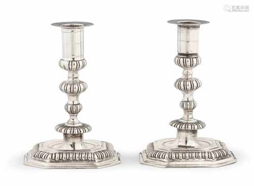 A pair of Berlin silver candlesticksAngular base with chamferred corners and gadrooned rim, the