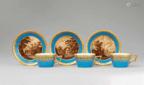 A rare set of three Vienna porcelain cups and saucers with views of SchwetzingenOf tapering