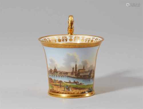 A Vienna porcelain cup and saucer with a view of DresdenBell-shaped cup with tall scroll handle.