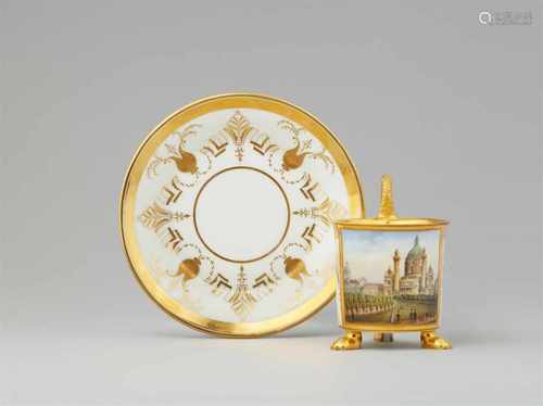 A Wahliss porcelain cup and saucer with a depiction of the Carlskirche in ViennaCylindrical cup on