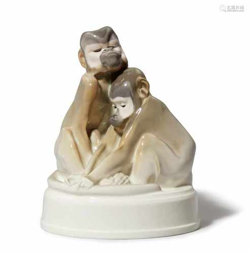 A Berlin KPM porcelain model of monkeysModel no. 9360. Signed to the back of the plinth A.