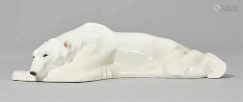 A Berlin KPM model of a polar bear laying downModel no. 9394. Engraved PUCHEGGER. Blue sceptre