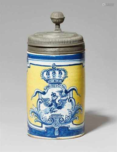 A yellow Berlin faience tankard with Prussian eagleDecorated with a large foliate cartouche above