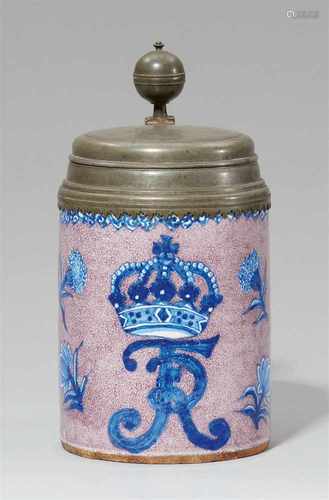 A rare Berlin faience tankard with a royal monogramWith crowned FR monogram amid scattered woodcut