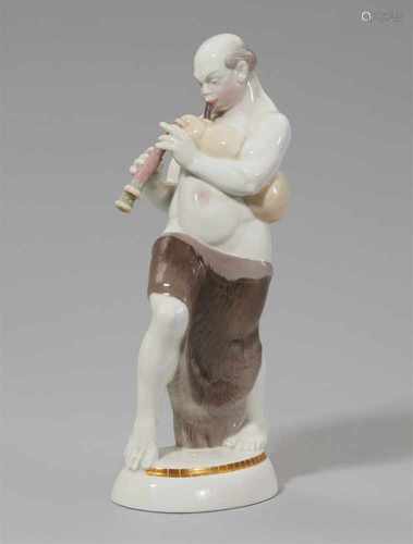 A Berlin KPM porcelain figure of an Arabian man playing bagpipesModel no. 9624. Stamped AMBERG to