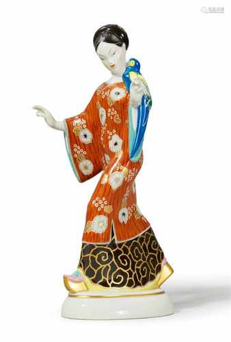 A Berlin KPM porcelain model of a Chinese lady with a parrotModel no. 9446. Stamped AMBERG to the