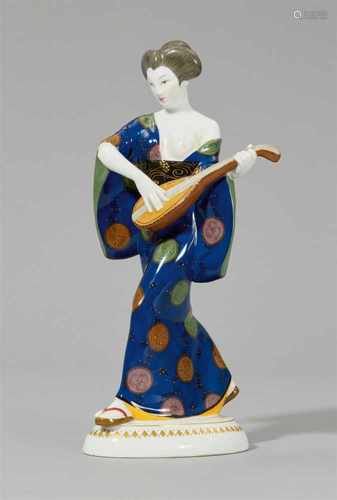 A Berlin KPM porcelain figure of a Japanese lady with a mandolinModel no. 9221. Stamped to the