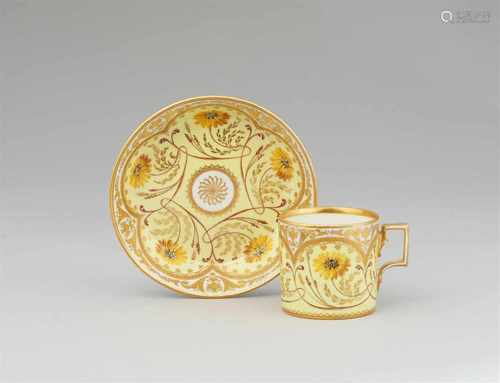 A Vienna porcelain cup and saucer with yellow chrysanthemumsOf cylindrical form with original