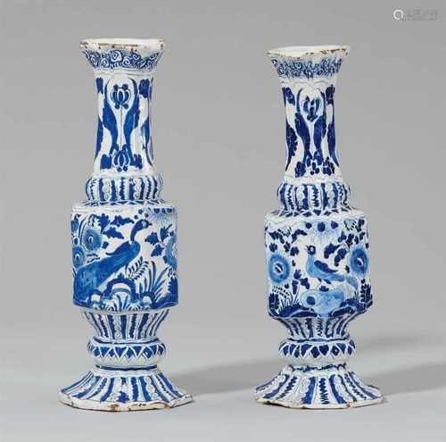 Two Berlin faience flasks with bird motifsTwo ribbed vases with angular waists on octagonal bases.