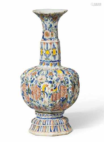 A ribbed Berlin faience vase with peacock decorBulbous vase of octagonal section with a tall