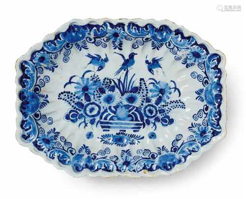 A Berlin faience basin with a basket of flowersGadrooned basin of octagonal section, the centre