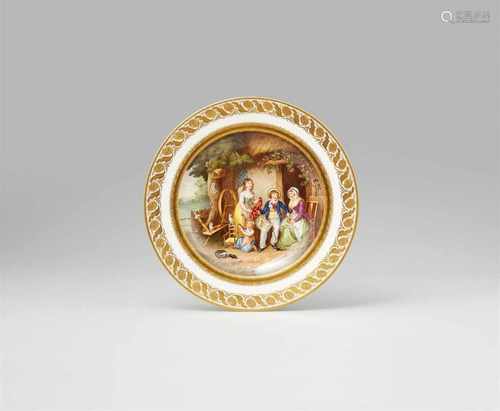 A Vienna porcelain plate with a painting reproductionShallow dish painted with a peasant family by