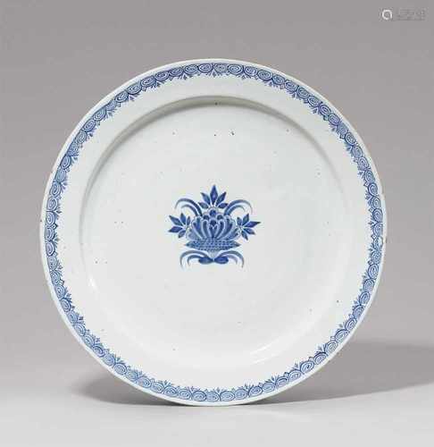 A large Berlin faience platter with a fanciful floral motifShallow dish. Unmarked. Open pores and