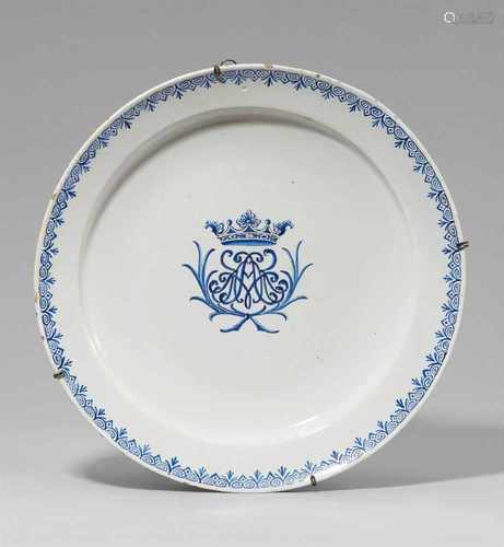 A large Berlin faience platter with a monogramShallow dish decorated with the crowned monogram AMK