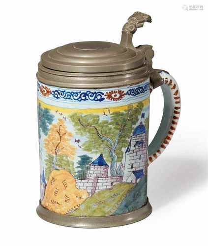 A Berlin faience tankard with landscape decorUnmarked. Cracks, rim chips. With pewter lid,