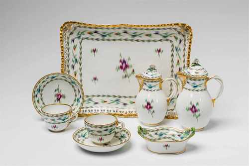 A Vienna porcelain tête à tête with Atlas decorComprising a rectangular tray with pierced border,