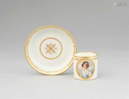 A Vienna porcelain cup with a portrait of a young ladyOf cylindrical form with original saucer. Blue