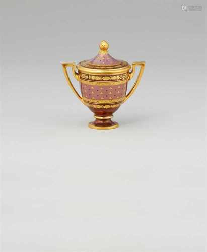 A small Vienna porcelain vase with lustre groundUrn with angular handles and cover with a pinecone