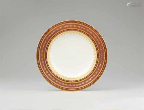 A Vienna porcelain dinner plate with bi-colour copper lustre groundDeep dish with concentric bands