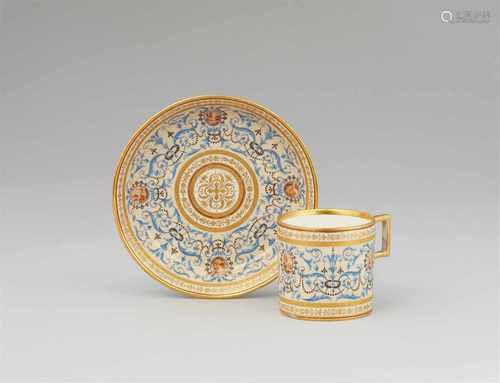 A Vienna porcelain cup and saucer with blue arabesquesOf cylindrical form with original saucer.