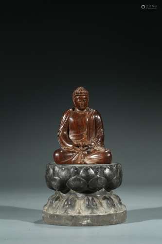 A CHINESE HUANGHUALI BUDDHA WITH STONE STAND
