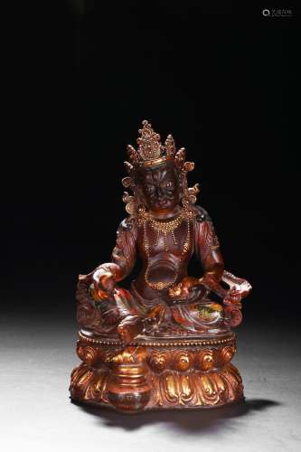 A GLASS GILT-LACQUERED FIGURE OF JAMBHALA