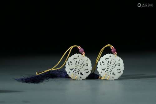 A PAIR OF CHINESE WHITE JADE 'SHOU' PENDANTS