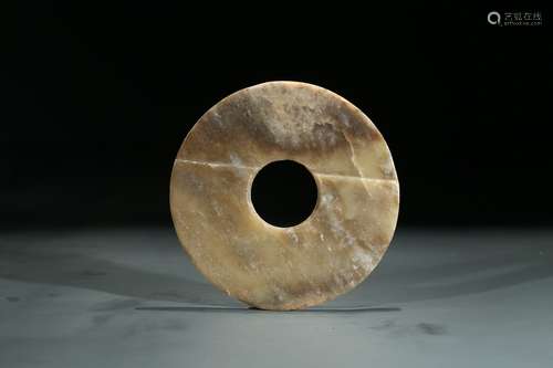 A CELADON JADE CARVED DISC